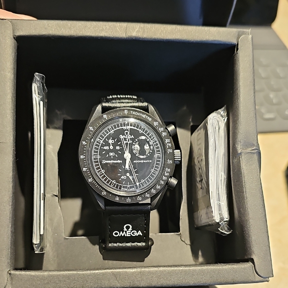 OMEGA x SWATCH MISSION TO THE MOONPHASE SPEEDMASTER SNOOPY WATCH.